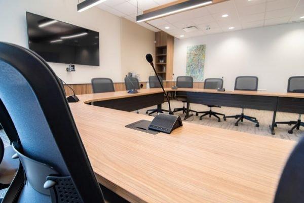 a conference room with a large table and chairs